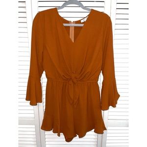 A burnt orange romper, never worn!